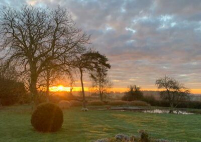 Sunset across the gardens at Freedom Farm in Suffolk